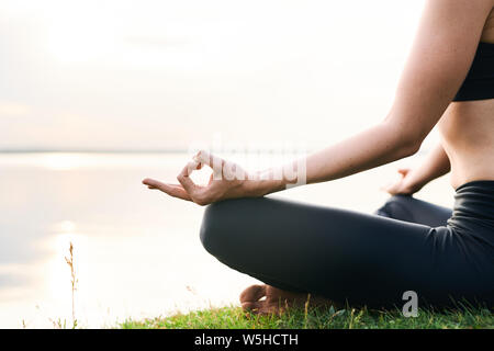 Practicing yoga in unity with nature Stock Photo