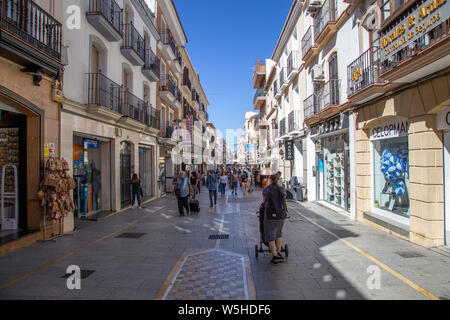 Shopping street in Ronda, Spain Stock Photo - Alamy