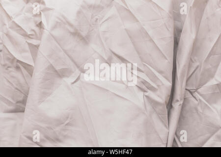 Gray canvas that is wrinkled. Fabric crease background and texture Stock Photo