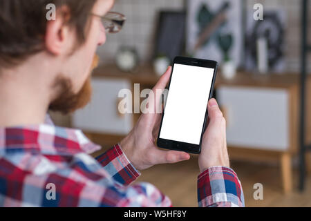 Mockup image - man holding black smartphone with white blank screen Stock Photo