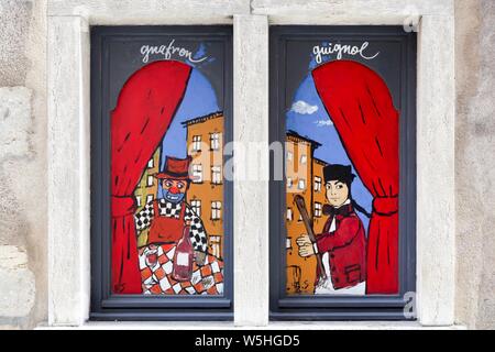 Lyon, France - October 12, 2016: Guignol puppet on a window. Guignol is the main character in a French puppet show Stock Photo