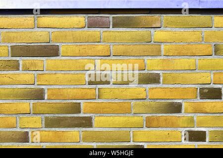 Detailed close up view on yellow colored old and weathered vintage brick walls in high resolution Stock Photo