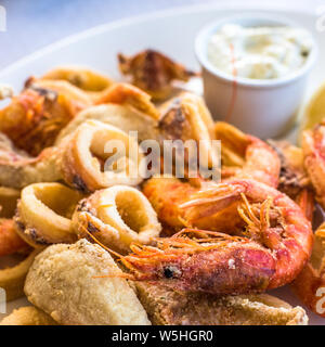 Mixed deep-fried fish, shrimp and squid platter Stock Photo