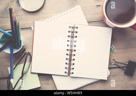 working wooden table on different office accessories Stock Photo