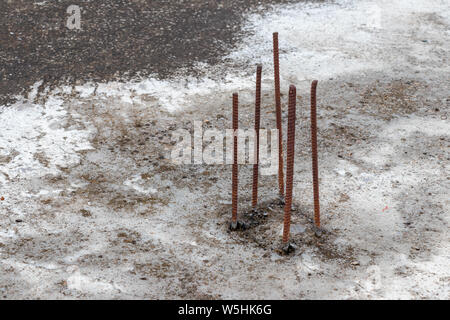 Steel TMT bars of concrete beam exposed on the roof, for column construction later Stock Photo