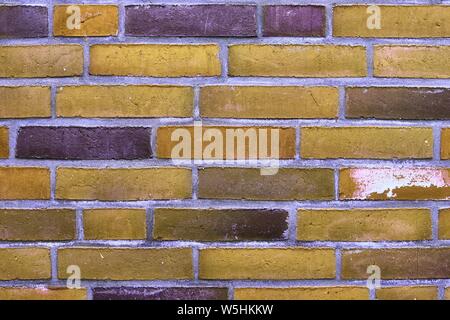 Detailed close up view on yellow colored old and weathered vintage brick walls in high resolution Stock Photo