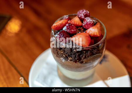 strawberry with chocolate and vanila pudding in glass cup Stock Photo