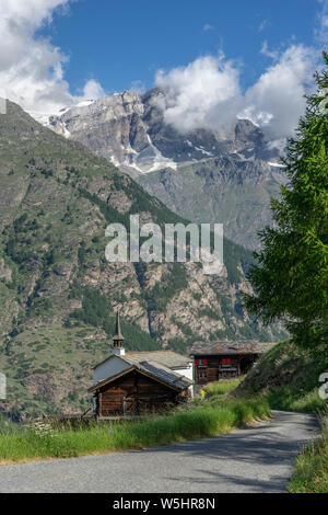 traditional wooden houses in the village of Taesch, high above Zermatt, the famous touristic destination in the canton Valais, Wallis, Switzerland Stock Photo