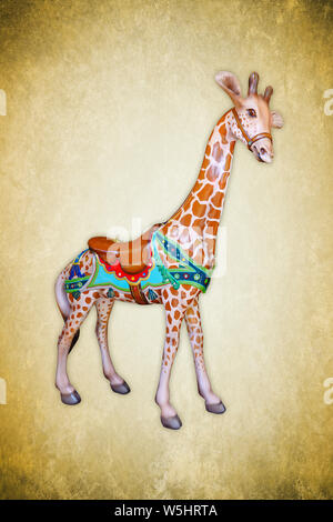 Carnival carousel giraffe isolated on green background Stock Photo