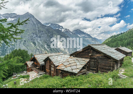 traditional wooden houses in the village of Taesch, high above Zermatt, the famous touristic destination in the canton Valais, Wallis, Switzerland Stock Photo