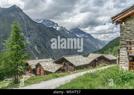 traditional wooden houses in the village of Taesch, high above Zermatt, the famous touristic destination in the canton Valais, Wallis, Switzerland Stock Photo