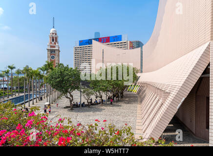 Hong Kong Cultural Centre looking towards the Former Kowloon-Canton Railway Clock Tower, Tsim Sha Tsui Promenade, Kowloon, Hong Kong, China Stock Photo