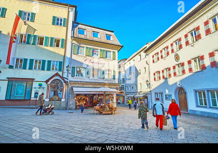 ZELL AM SEE, AUSTRIA - FEBRUARY 28, 2019: The Stadtplatz square has modest architecture, its traditional buildings are decorated with colorful shutter Stock Photo