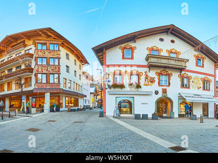 ZELL AM SEE, AUSTRIA - FEBRUARY 28, 2019: Panorama of old town street with classic Alpine houses, occupied with hotels, cafes and stores, on February