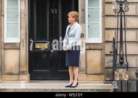 Edinburgh, UK. 29th July, 2019. Prime Minister and Conservative Leader, Boris Johnson visits Bute House to meet First Minister of Scotland, Nicola Sturgeon. Earlier in the day, Johnson announced £300m of funding for projects to boost the economy in Scotland, Wales and Northern Ireland. Pictured: FM Nicola Sturgeon waits for the Prime Minister to arrive Credit: Rich Dyson/Alamy Live News Stock Photo