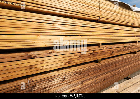 stack of terrace boards for sale at lumber yard Stock Photo