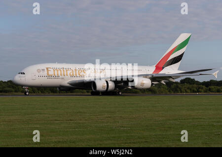 An Emirates Airbus A380-800 lands at Manchester International Airport (Editorial use only) Stock Photo