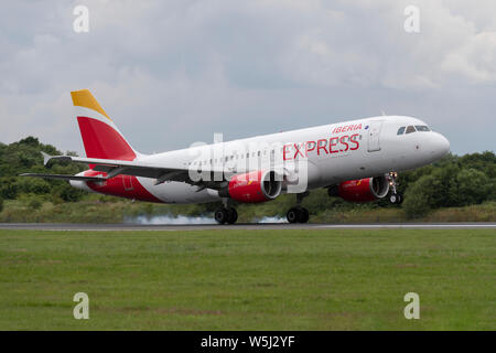 An Iberia Express Airbus A320-200 lands at Manchester International Airport (Editorial use only) Stock Photo