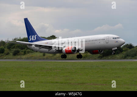 A SAS Scandinavian Airlines Boeing 737-800 lands at Manchester International Airport (Editorial use only) Stock Photo