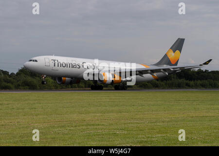 A Thomas Cook Airlines Airbus A330-200 lands at Manchester International Airport (Editorial use only) Stock Photo
