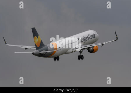 A Thomas Cook Airlines Airbus A321-200 takes off from Manchester International Airport (Editorial use only) Stock Photo