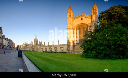 Cambridge, UK - June 9, 2019: Golden hour dawn sunlight on the front facade of King's College, Cambridge from the King's Parade. Stock Photo