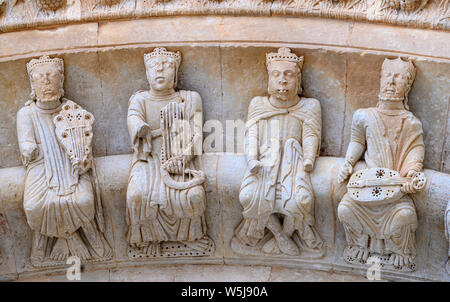 Carved figures of medeival musicians on the 13th century, Romanesque, North door, of the Collegiate church of Santa María la Mayor, Toro, Zamora Provi Stock Photo