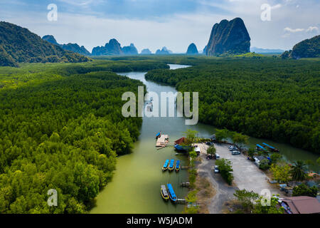 Aerial view of colorful traditional Longtail boats at a small pier in a mangrove forest (Phang Nga Bay) Stock Photo