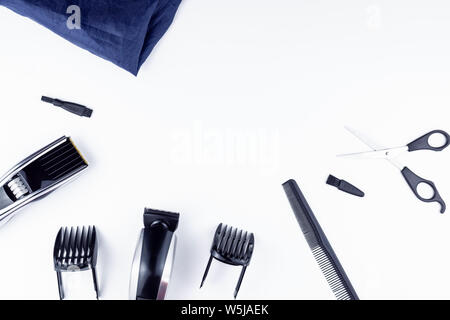 machine for haircuts. On the table are scissors and a comb. Barbershop. Hair clipper are on the table. Hairstyles Cut hair. Stock Photo