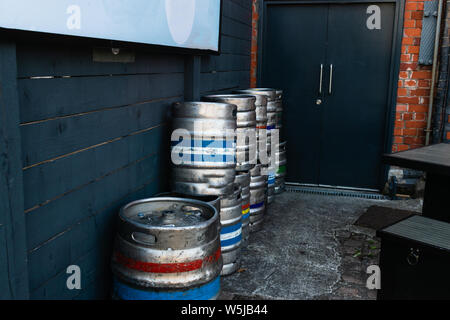 Beer cask's with coloured stripes stacked up. Stock Photo