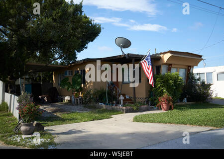 permanent trailer park home with us flag in trailer park rv park homes in florida usa united states of america Stock Photo