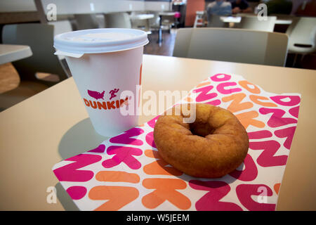 dunkin donuts coffee and traditional ring donut in a restaurant florida usa united states of america Stock Photo