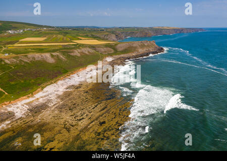 Aerial view of cliffs and waves on the Worm's Head area of the Gower peninsula