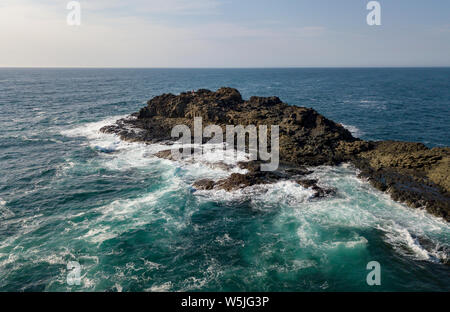 A view from Kiama Blow Hole Point on the south coast of New South Wales, Australia. In aboriginal the word Kiama means ‘where the ocean makes noise’. Stock Photo