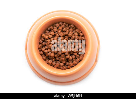 Natural Dry brown Cat Food in Plastic Bowl isolated on white Background - top View Stock Photo