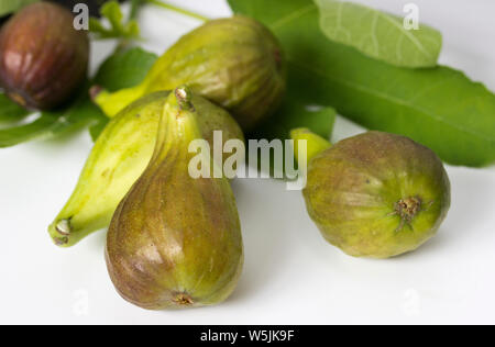 Ripe sweet figs on a white background Stock Photo