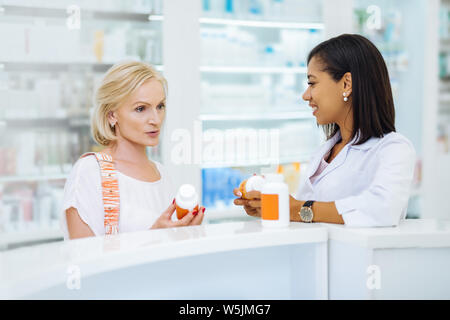 Concentrated female person being deep in thoughts Stock Photo