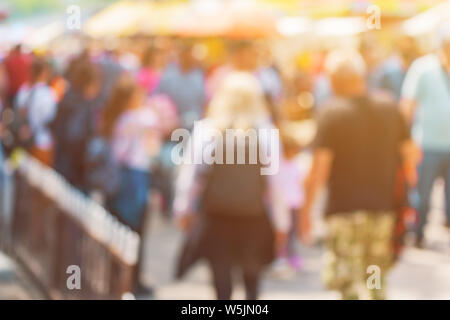 Blur city commuters walking on street, unrecognizable crowd out of focus as background for various community and people related themes Stock Photo