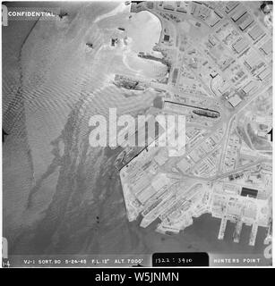 [Aerial photograph shot at 7000 feet altitude, showing one unidentified CVL type carrier in docks along with several other ships. Hunters' Point (San Francisco Naval Shipyard) San Francisco, CA] Stock Photo