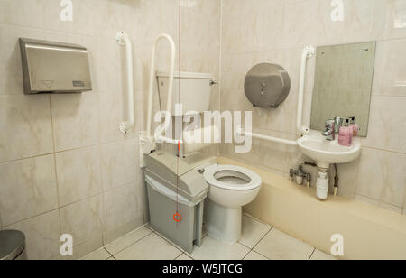 Disabled toilet facilities with handrails and emergency alarm Stock Photo