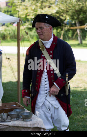 A reenactor in the enlisted military uniform of a Contienetal Army Sergeant at Historic Old Fort Wayne in Fort Wayne, Indiana, USA. Stock Photo