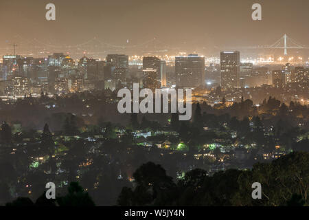 Oakland and San Francisco Cityscapes on a Hazy Summer Night. Stock Photo