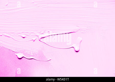 Pink sheet of plywood with pink paint stains Stock Photo