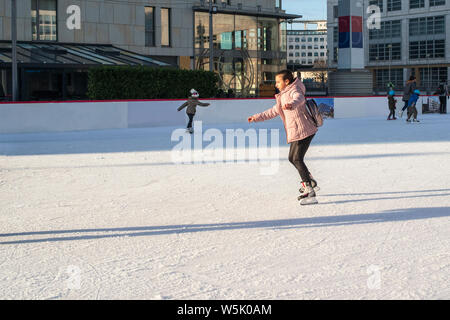 Slovakia, December 2018 ice skating. Outdoor activities on the street.outdoor ice skating at rink. Girl teenager skates. Stock Photo
