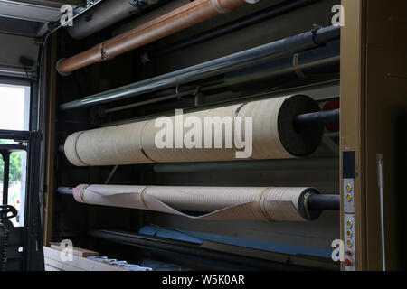 Lots of colorful folded carpets in stock. Stock Photo