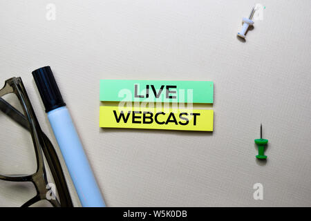 Live Webcast text on sticky notes isolated on office desk Stock Photo