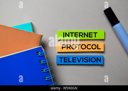 Internet Protocol Television - IPTV text on sticky notes isolated on office desk Stock Photo