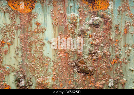 Very rusted corroded painted metal surface shot as a background Stock Photo