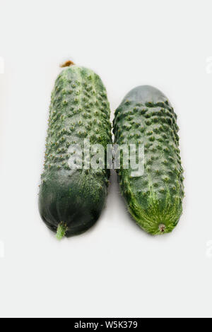 Two fresh green cucumbers isolated on white background Stock Photo