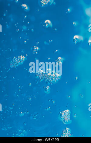 light reflected in water with air bubbles and bokeh Stock Photo